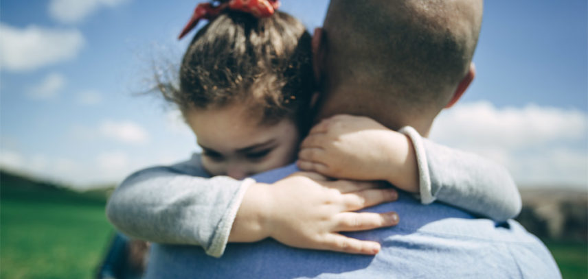 Daughter hugging her father